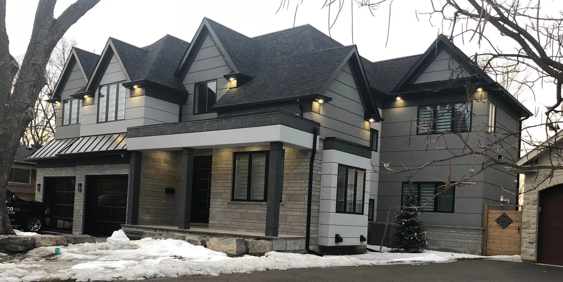 Luxury home exterior remodelled with new stucco and trim