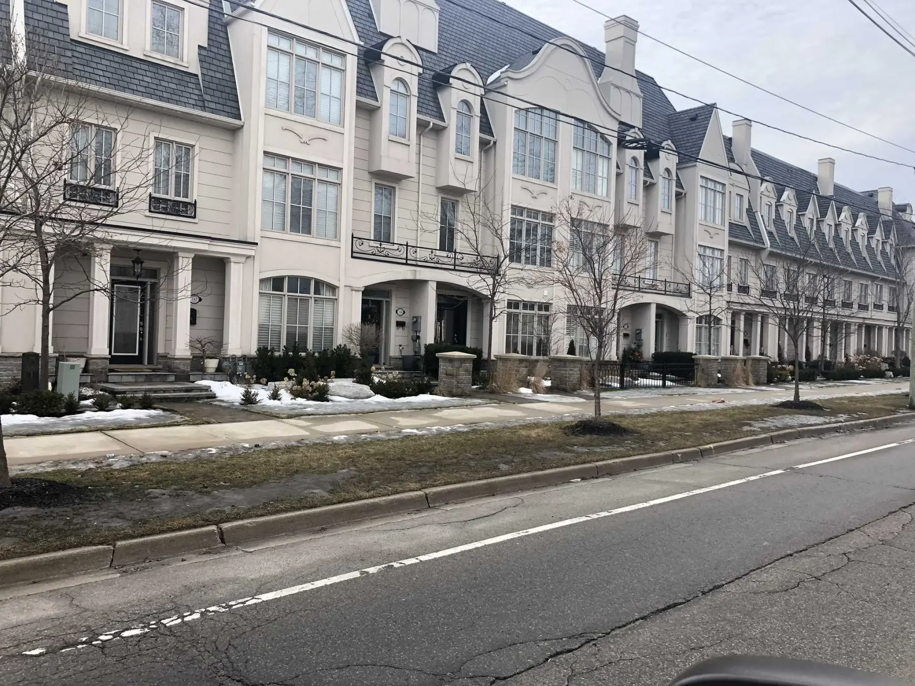 Natural stone accent installed alongside stucco walls