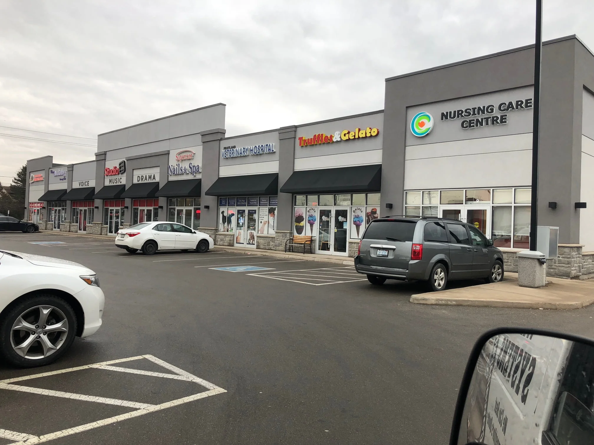 Low-rise commercial building refinished in acrylic stucco
